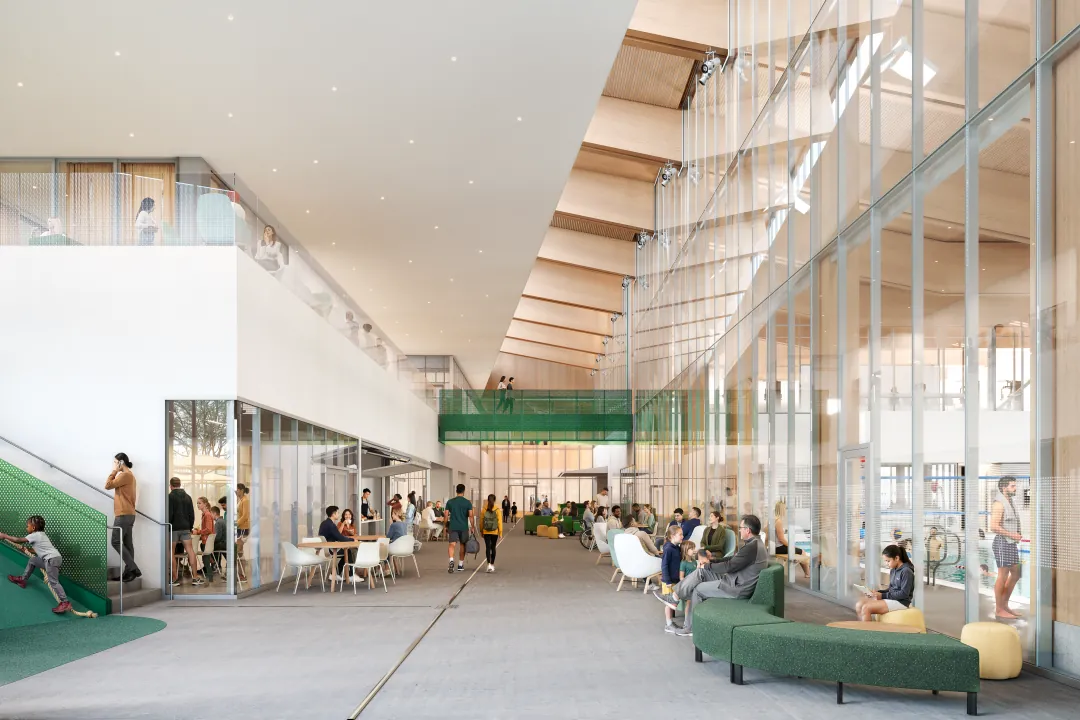 Light-filled lobby of the Burke Mountain Community Centre with seating and a kids' climbing stair