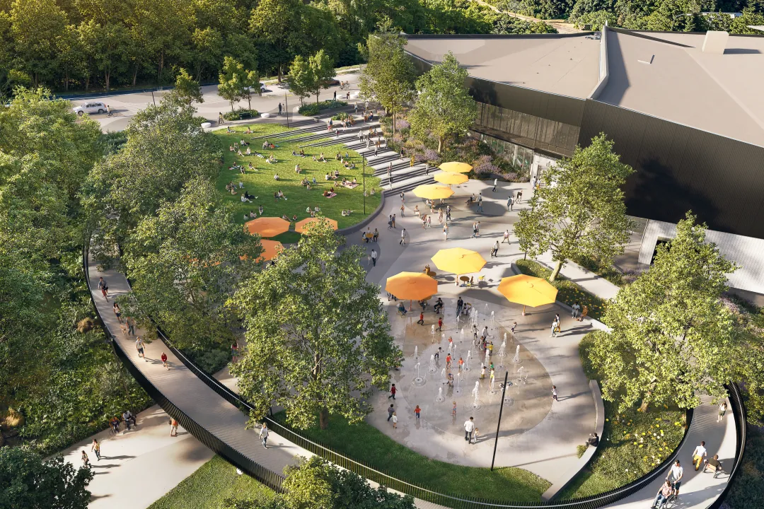Aerial view of Burke Village Park with splash pad, lawn and elevated pathway