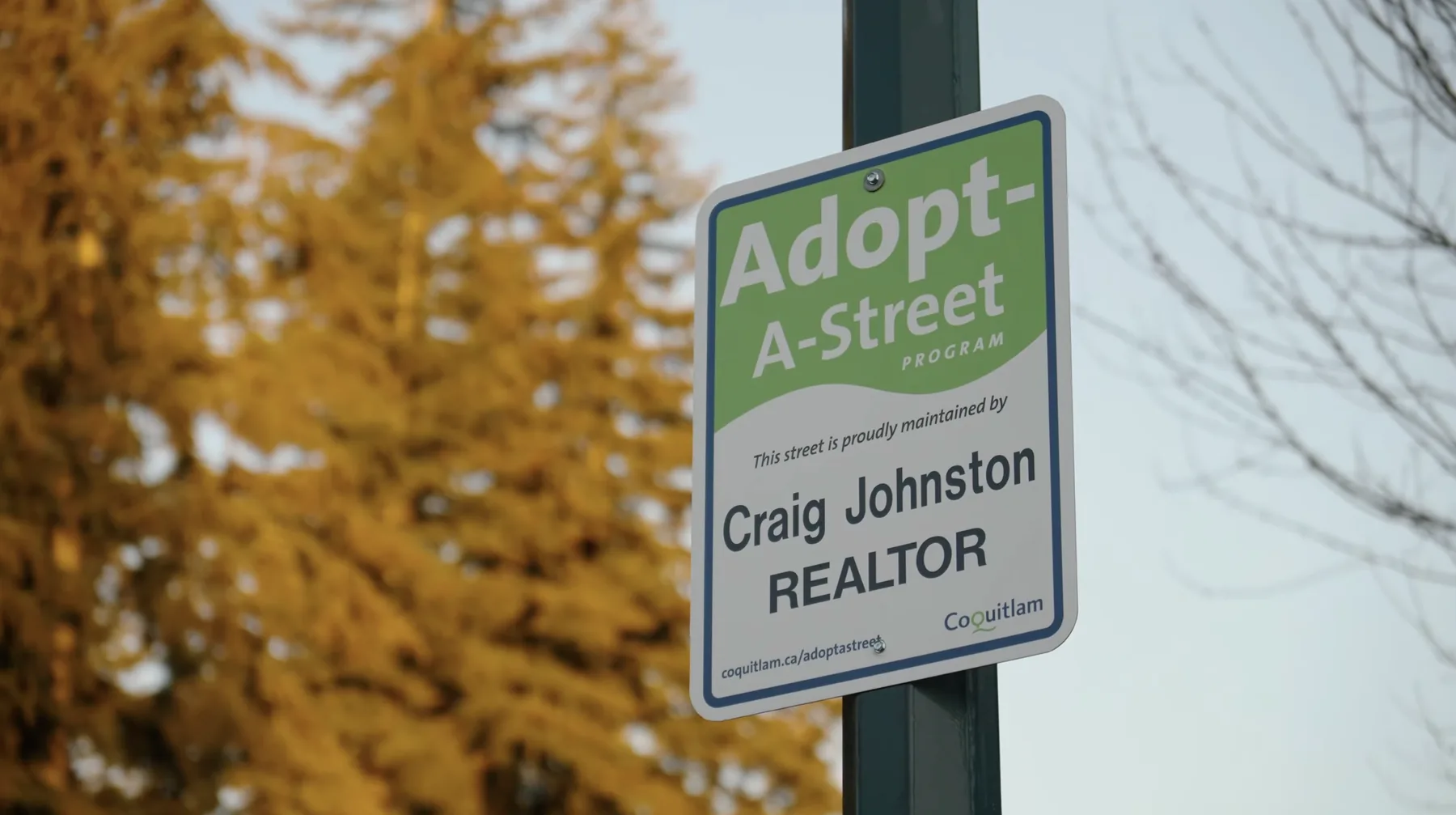 Coquitlam Adopt-A-Street sign reading: this street proudly maintained by Craig Johnston, REALTOR