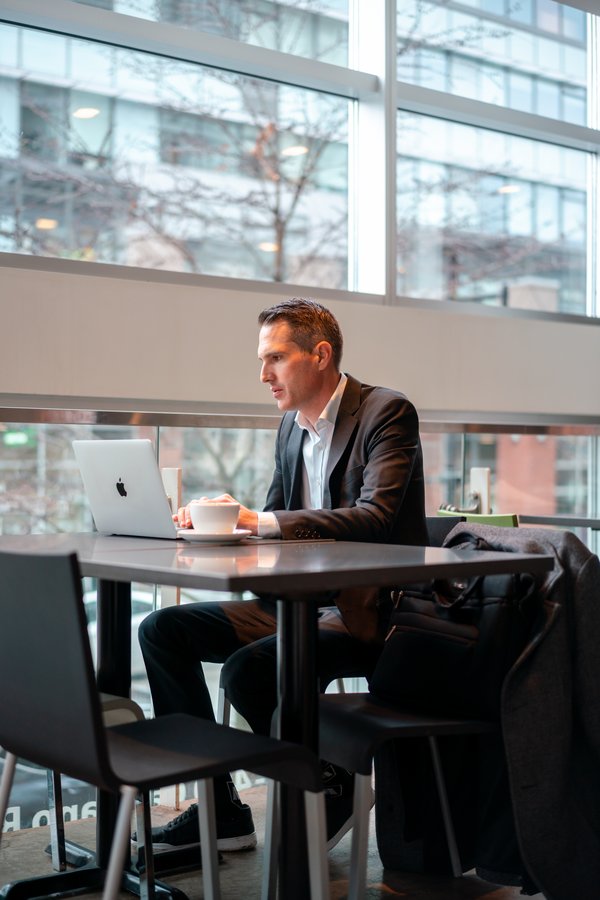 Craig Johnston working on a seller strategy at a laptop