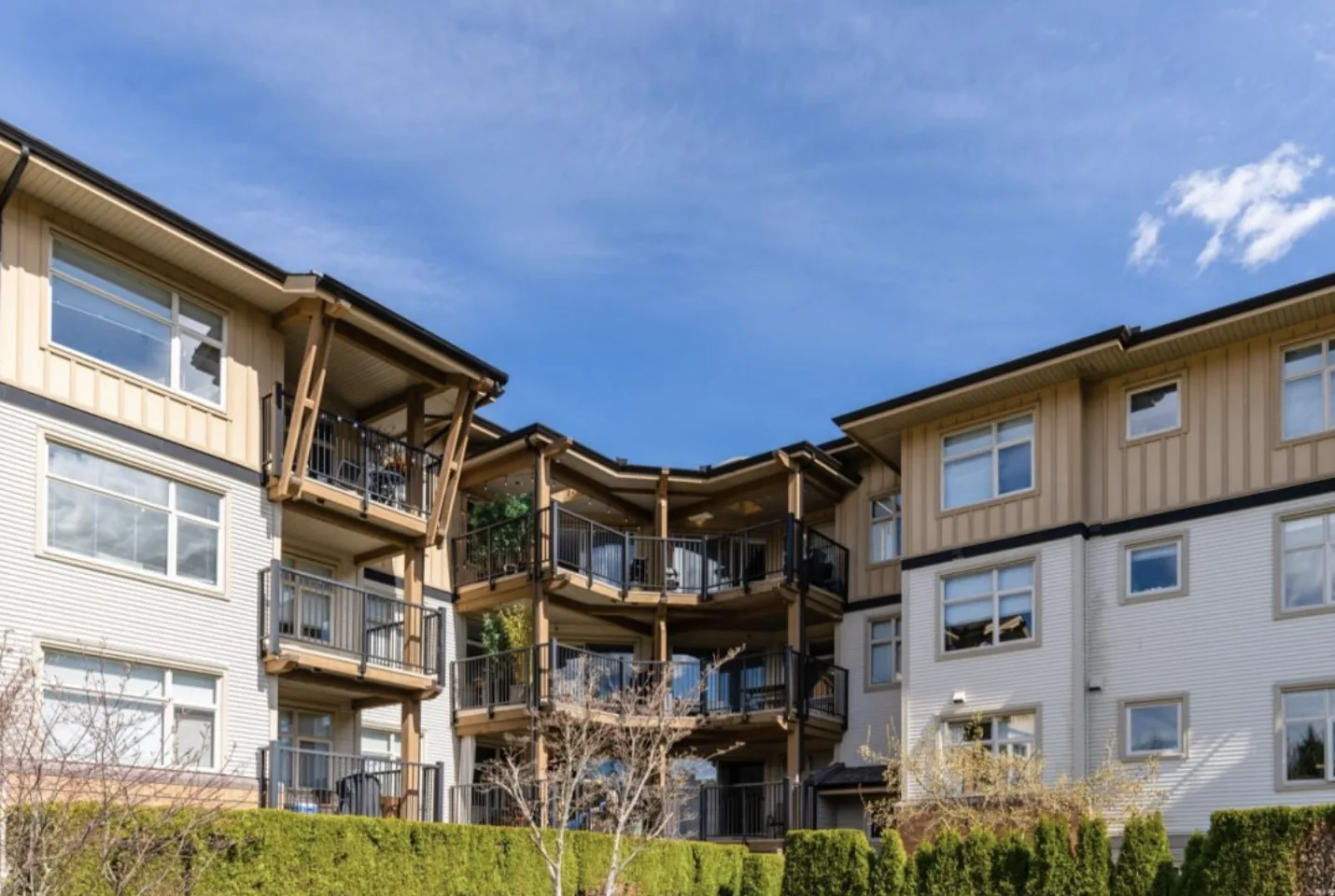 A typical Klahanie low-rise wood-frame building with private balconies, Port Moody