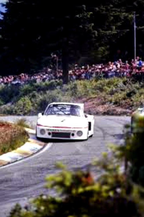 A Porsche 935 in the Westwood Motorsports Park paddock during a race weekend in the 1980s.