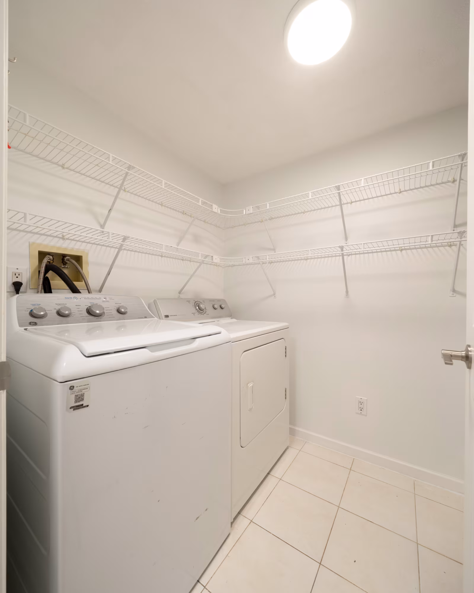 Dedicated laundry room with full-size washer and dryer at #105 20240 54A Avenue, Langley City