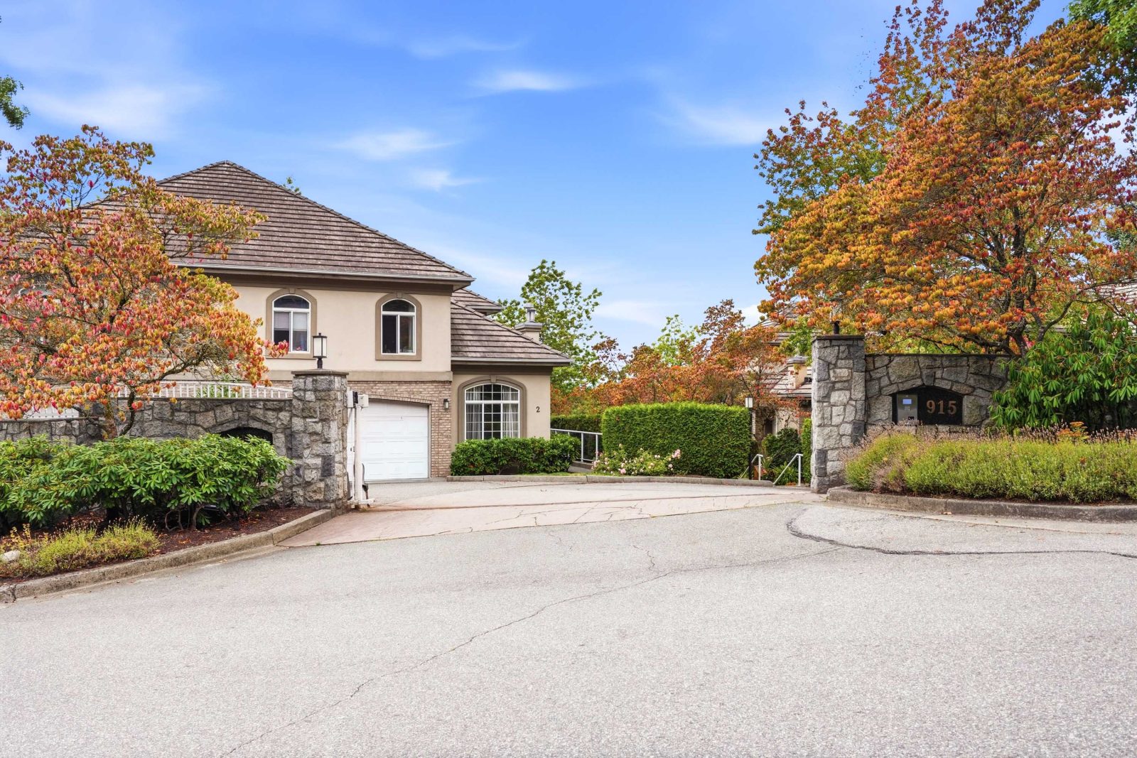 Stone gated entrance to Brittany Place townhome complex on Fort Fraser Rise, Port Coquitlam