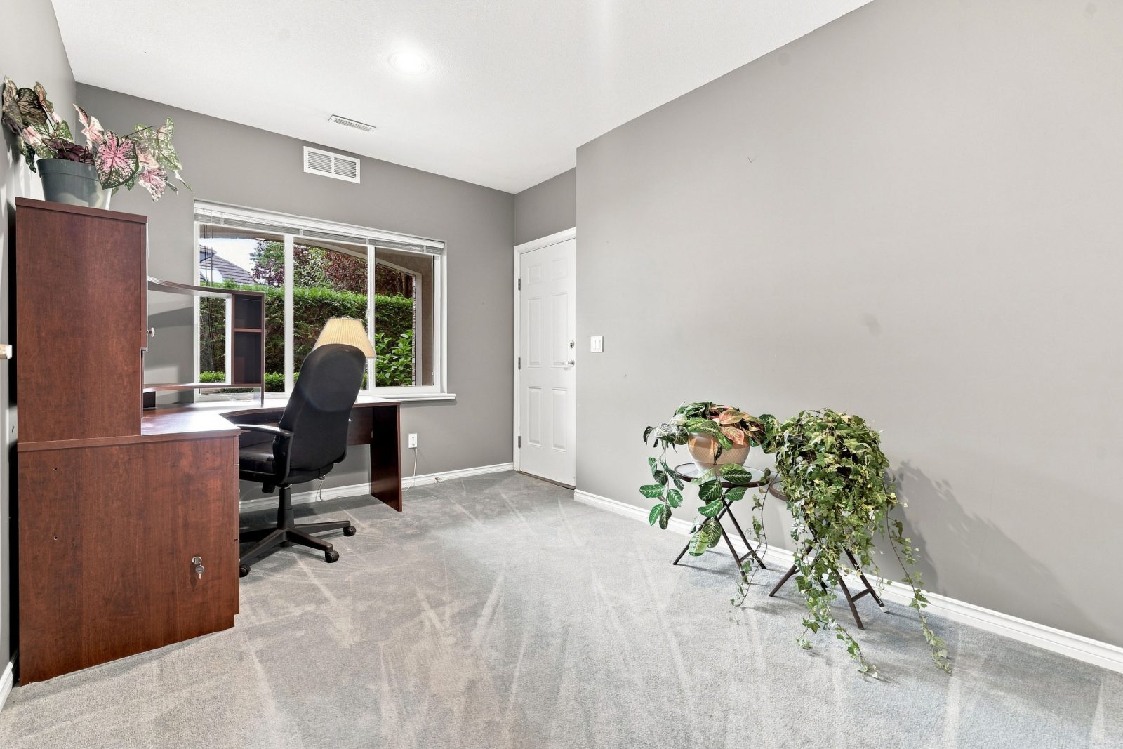 Lower-level fourth bedroom set up as a home office at #11 915 Fort Fraser Rise