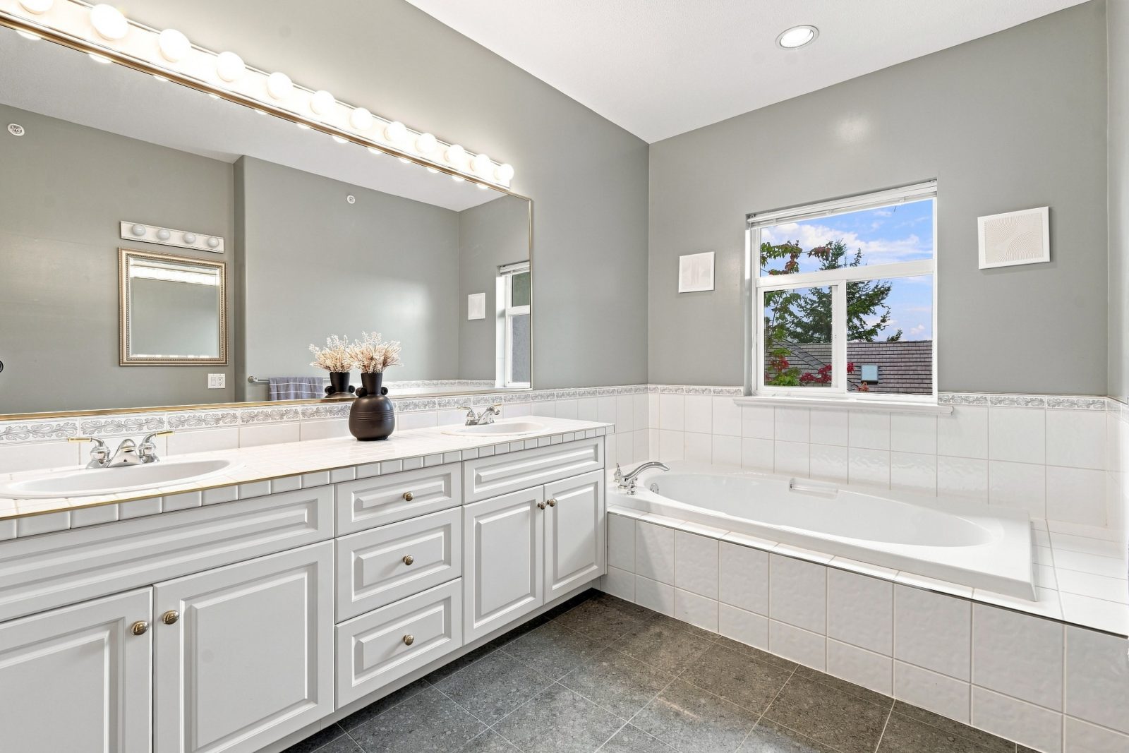 Primary ensuite with double vanity and soaker tub at #11 915 Fort Fraser Rise